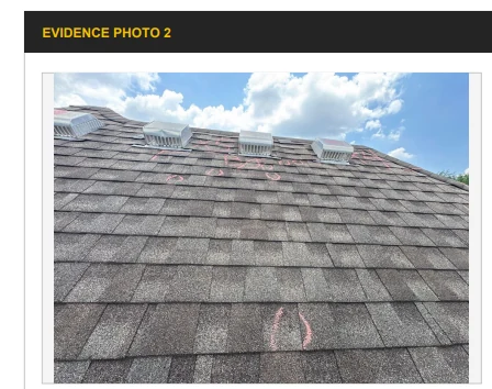 Roof inspection photograph of a shingled slope with pink chalk inspection markings and roof ventilation components